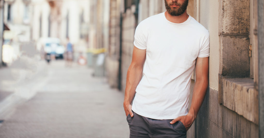 man leaning towards a wall